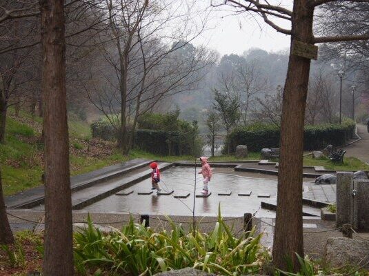 kids playing under the rain