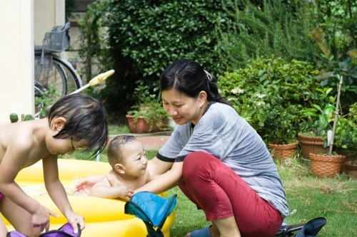 mother bathing kids